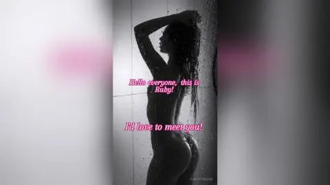 Moody black and white silhouette of a woman posing in a shower setting.