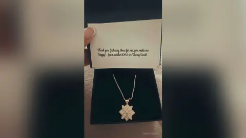 Gold flower pendant necklace in a gift box with a heartfelt handwritten thank you note.