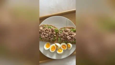 ChristineDavis prepared a plate of avocado toast topped with tuna and several halves of hard-boiled eggs.