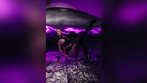 Fashionable woman in black leather outfit posing in a futuristic neon purple studio setting.