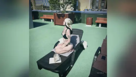 SofiMils sits naked on a black lounge chair outdoors, posing with her back arched and her hair tied up in a bun.