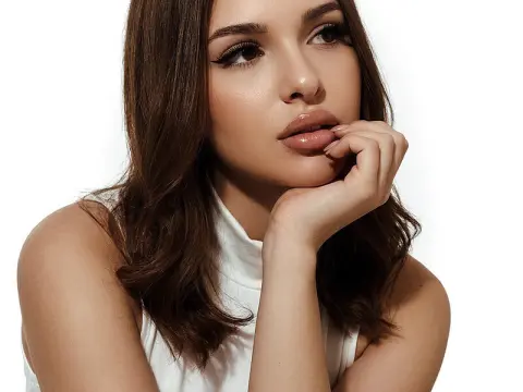 Lindsey Lu — Lindsey Lu poses with her chin resting on her hand, wearing a white sleeveless top against a white background.