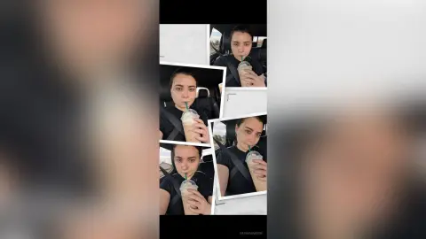 Young woman in a black t-shirt enjoying an iced coffee drink inside a car on a bright day.