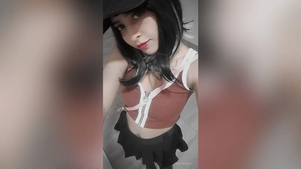 AuroraGray β AuroraGray wears a brown crop top and black skirt while posing in a black hat.