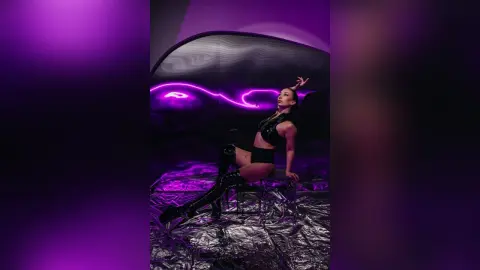 Fashionable woman in black leather outfit posing in a futuristic room with purple neon lighting.