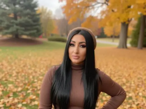 Woman in brown turtleneck sweater posing in a park with autumn leaves and fall foliage background.