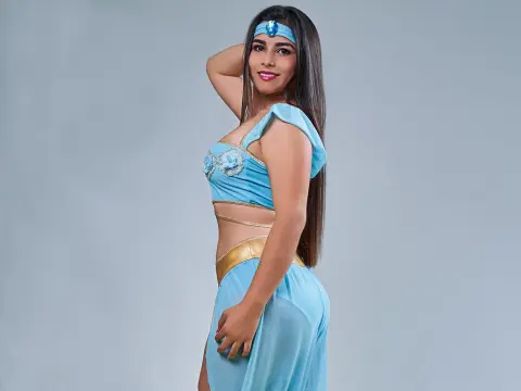 Princes_Jasmine — Princes_Jasmine poses in a light blue genie outfit and headband, looking over her shoulder with long dark hair.
