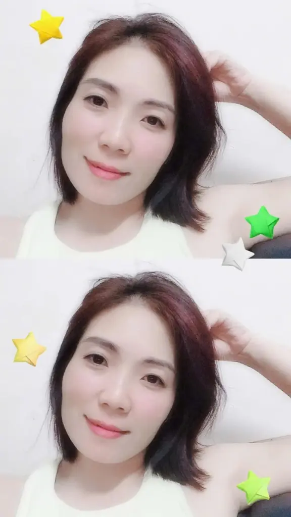 Mymy83 — Mymy83 smiles while resting her hand near her dark hair in a white tank top.