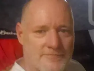 DannyMan502, a bald man with light stubble, looking directly at the camera in a close-up headshot.