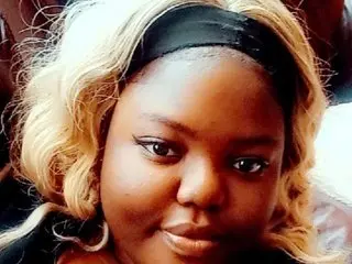 GoddessAthenaXx shows her face and blonde hair while looking directly at the camera in a close-up shot.