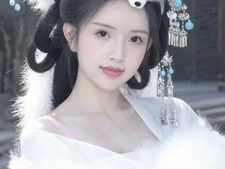 Beautiful woman in elegant white traditional Chinese hanfu with ornate silver hair accessories in a soft setting.