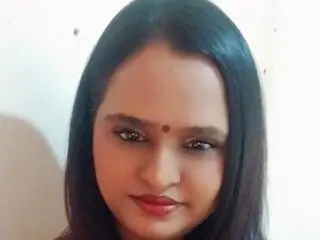 Indiansunshine19 is a beautiful woman with long black hair and dark eyes looking directly at the camera.