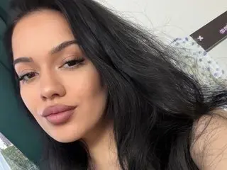 KatherineSwan shows off her long black hair and clear skin in a close-up selfie shot.