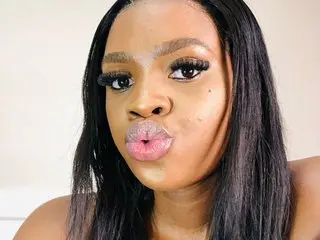 LusciousLipsT makes a playful pouty face while looking directly into the camera.