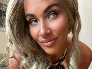 MiaMeeksXXX poses with a close-up headshot, showing her blonde hair and direct gaze toward the camera.