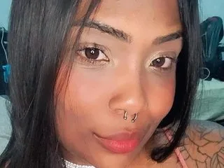 MileRabuda27 looks directly into the camera with a slight smile, showing her face and dark hair.