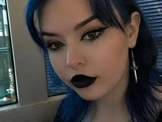 MillieRose_xo22 poses with a close-up headshot, showing her dark hair, winged eyeliner, and black lipstick.