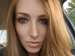 Miss_Brookes poses for a close-up selfie, showing her face and long blonde hair while looking directly at the camera.