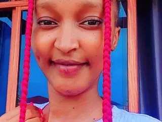 Petitpearll smiles while looking directly at the camera, showing her face and hair in a close-up shot.