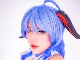 SOLEISTOONE, a woman with bright blue hair, looks directly at the camera against a plain white background.