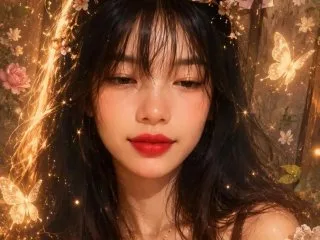 YaretziMe — YaretziMe looks directly at the camera with long dark hair and red lipstick, surrounded by warm, glowing light orbs.