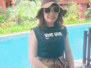 Yukichan66 — Yukichan66 wears a black sleeveless top and a brown sun hat while posing in front of a bright blue swimming pool.