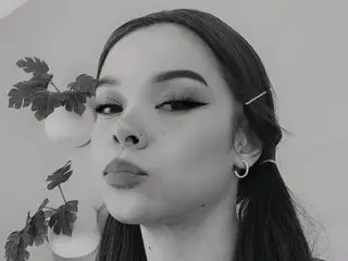 maralopeez poses with a pouty expression, showing her face, dark hair, and eyes in a close-up shot.