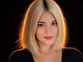 missbeckyy is a blonde woman with a bob haircut looking at the camera against a black background.
