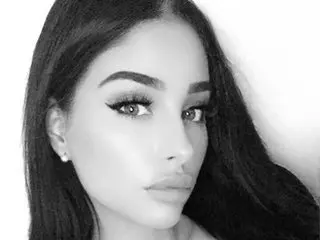 shanalove poses for a close-up headshot, showing her long dark hair and eyes looking directly at the camera.
